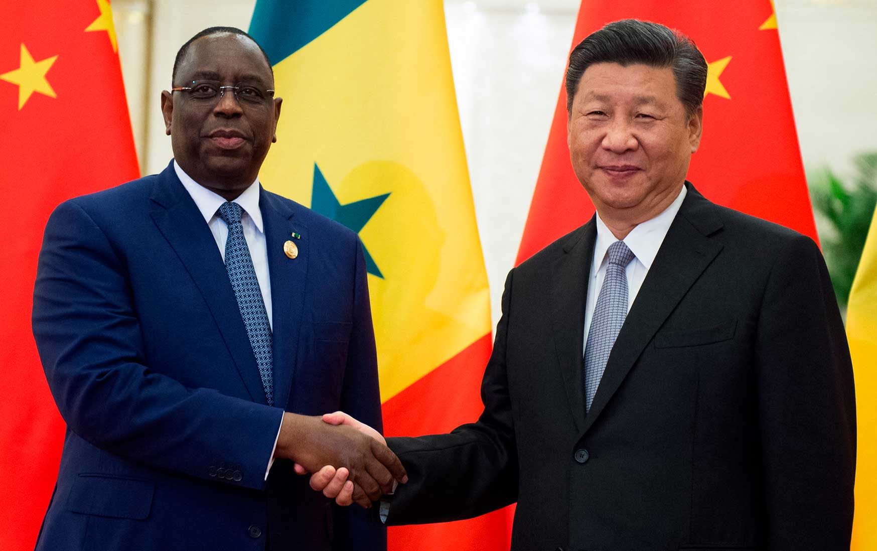 President Macky Sall shakes hands with China's President Xi Jinping
